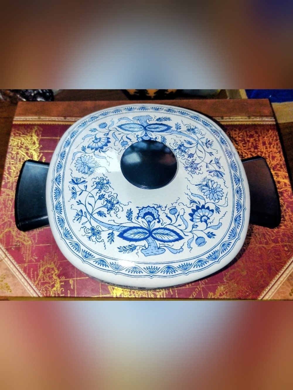 Vintage French bohemian style enameled pot featuring a blue and white casserole